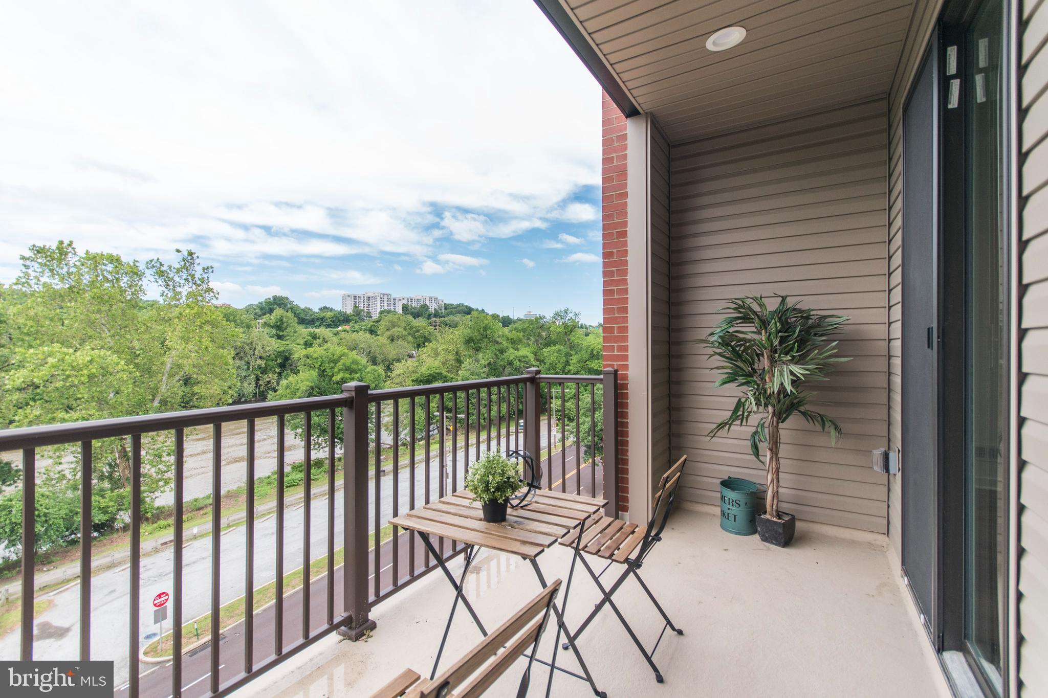 4443 River Ridge Court, Unit 13 Philadelphia, PA 19129 - Photo 32 of 35 a view of a balcony with chair and a potted plant