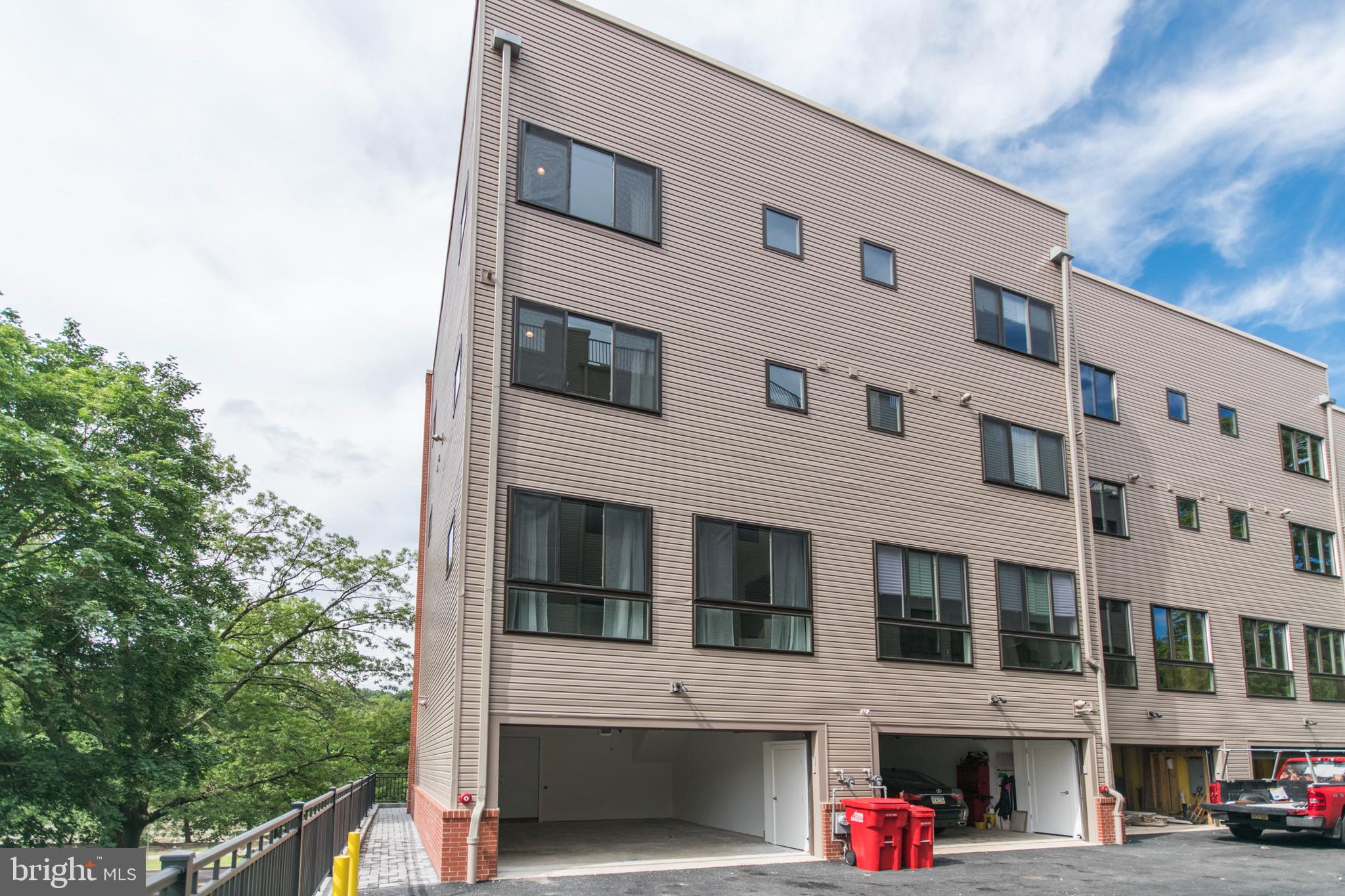 4443 River Ridge Court, Unit 13 Philadelphia, PA 19129 - Photo 35 of 35 a view of building with large windows