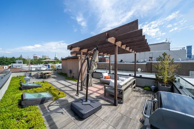 a view of a swimming pool with sitting area