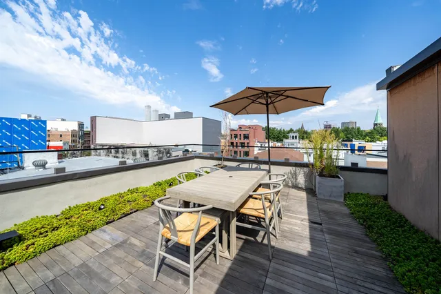 a view of a swimming pool with sitting area