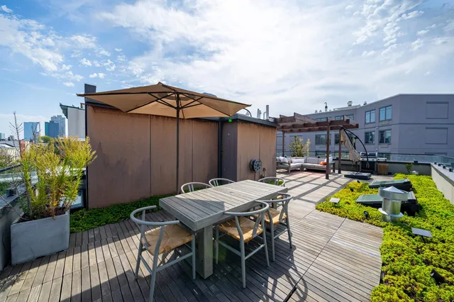 a view of a dinning table and chairs in patio