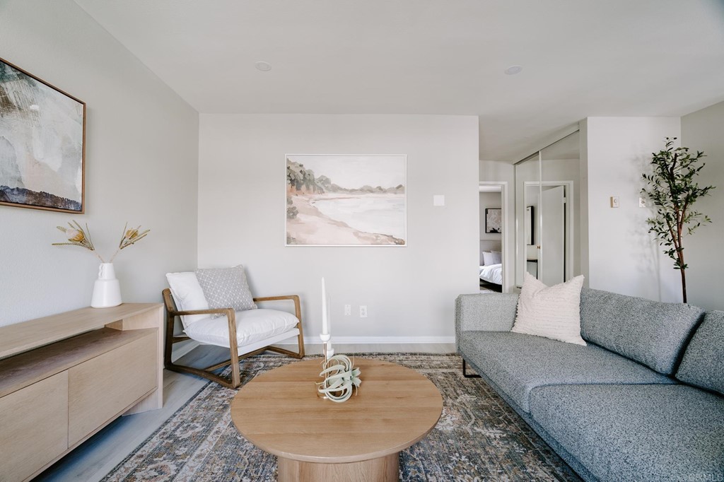13754 Mango Drive, Unit 218 Del Mar, CA 92014 - Photo 12 of 31 a living room with furniture and a wooden floor
