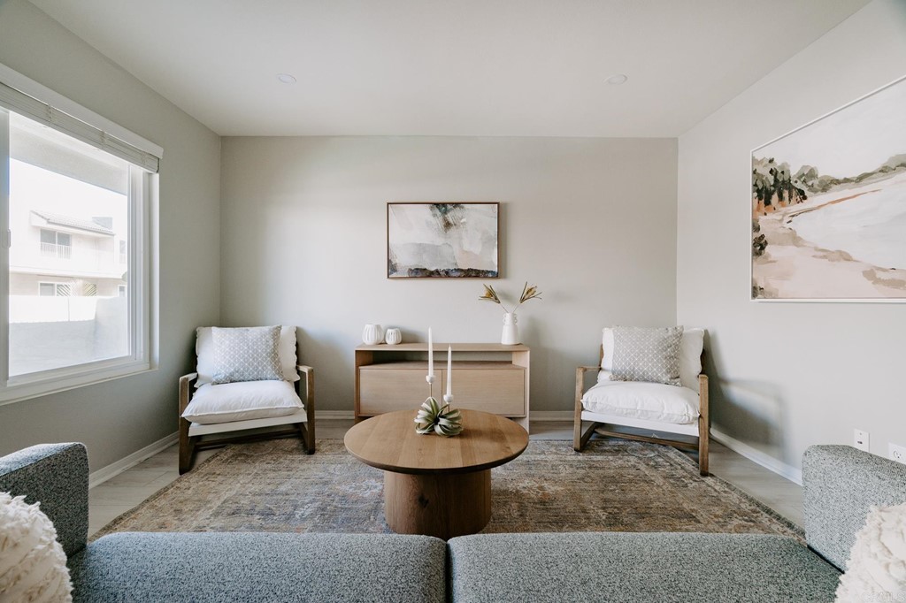 13754 Mango Drive, Unit 218 Del Mar, CA 92014 - Photo 13 of 31 a living room with furniture and a potted plant