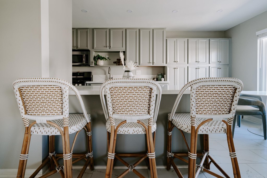 13754 Mango Drive, Unit 218 Del Mar, CA 92014 - Photo 10 of 31 a view of a dining room with furniture