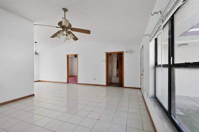 a view of a hallway with a chandelier