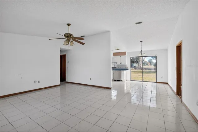 a view of a kitchen with a sink and a refrigerator cabinets
