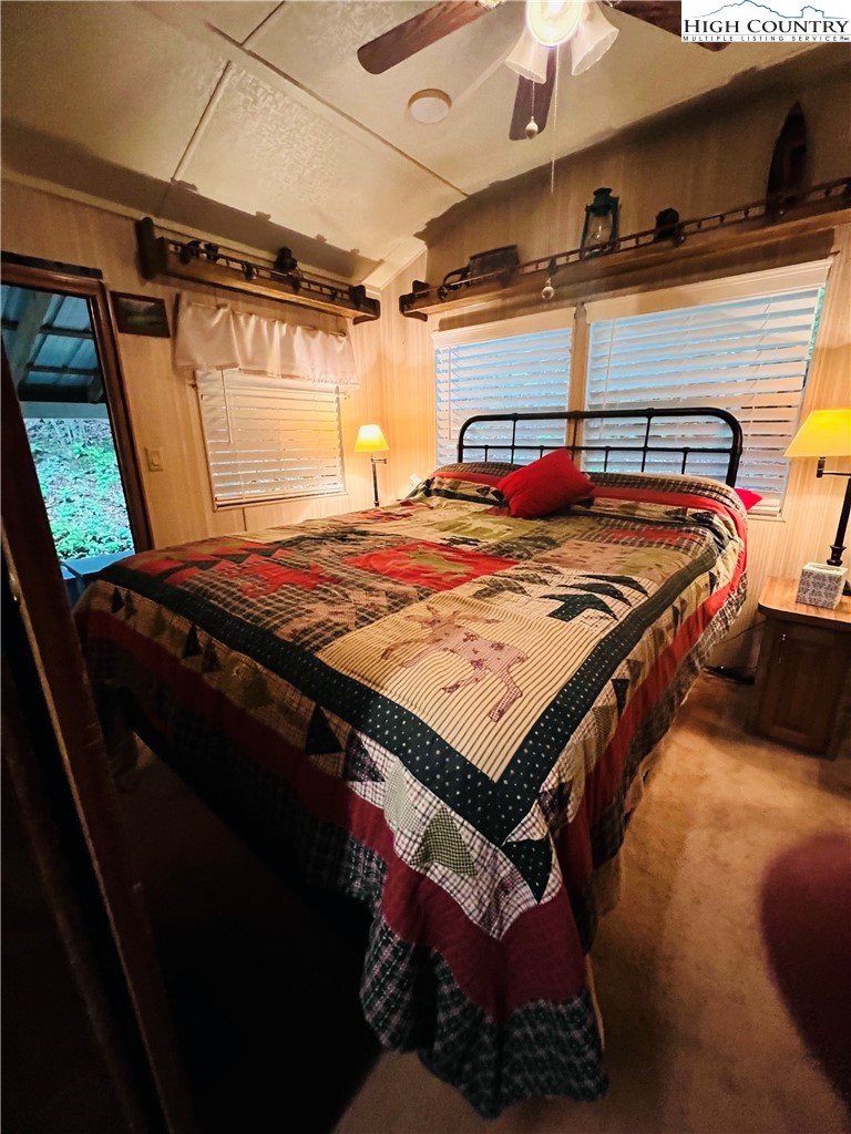 85 Jack Pine Loop Newland, NC 28657 - Photo 11 of 29 a bed sitting in a bedroom next to a window