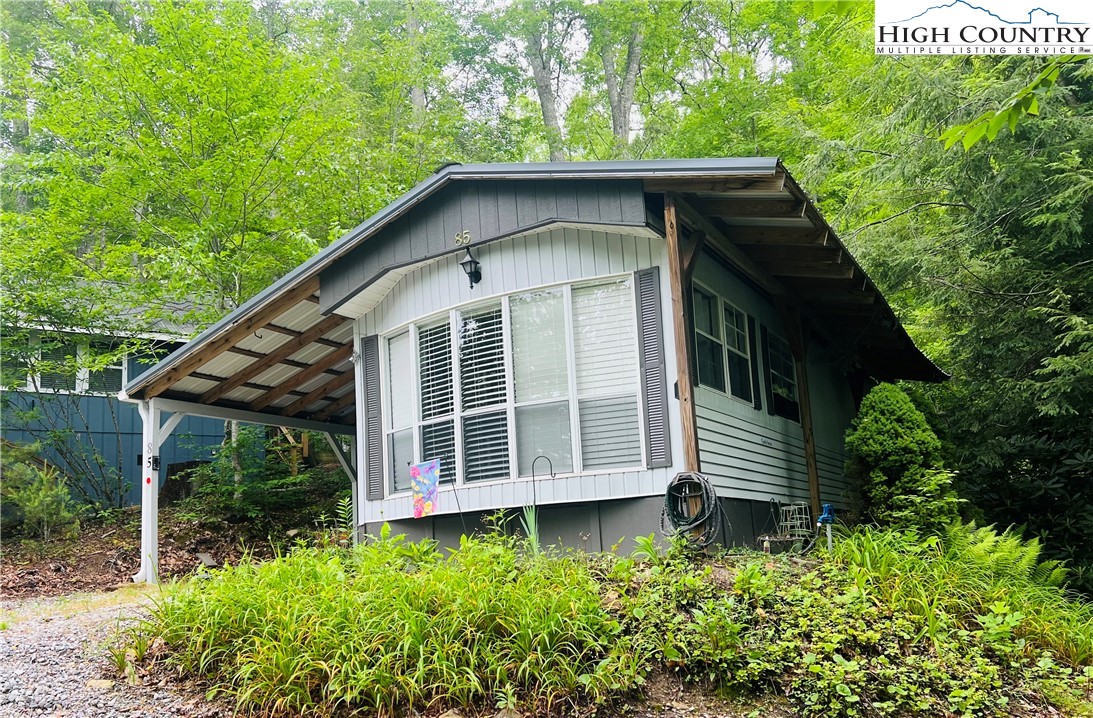 85 Jack Pine Loop Newland, NC 28657 - Photo 2 of 29 a view of a house with a yard