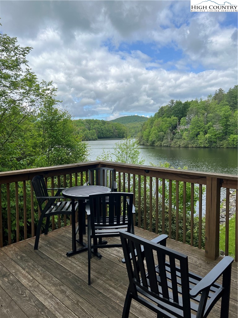 85 Jack Pine Loop Newland, NC 28657 - Photo 26 of 29 a view of a balcony with wooden floor and outdoor seating