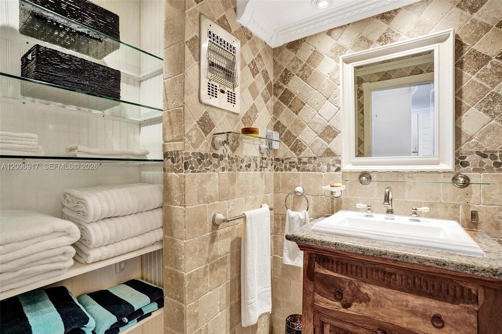1105 South Riverside Drive, Unit 107 Pompano Beach, FL 33062 - Photo 12 of 31 a bathroom with a sink and a mirror