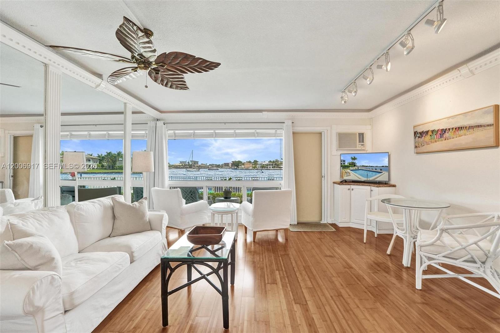 1105 South Riverside Drive, Unit 107 Pompano Beach, FL 33062 - Photo 14 of 31 a living room with furniture and a large window