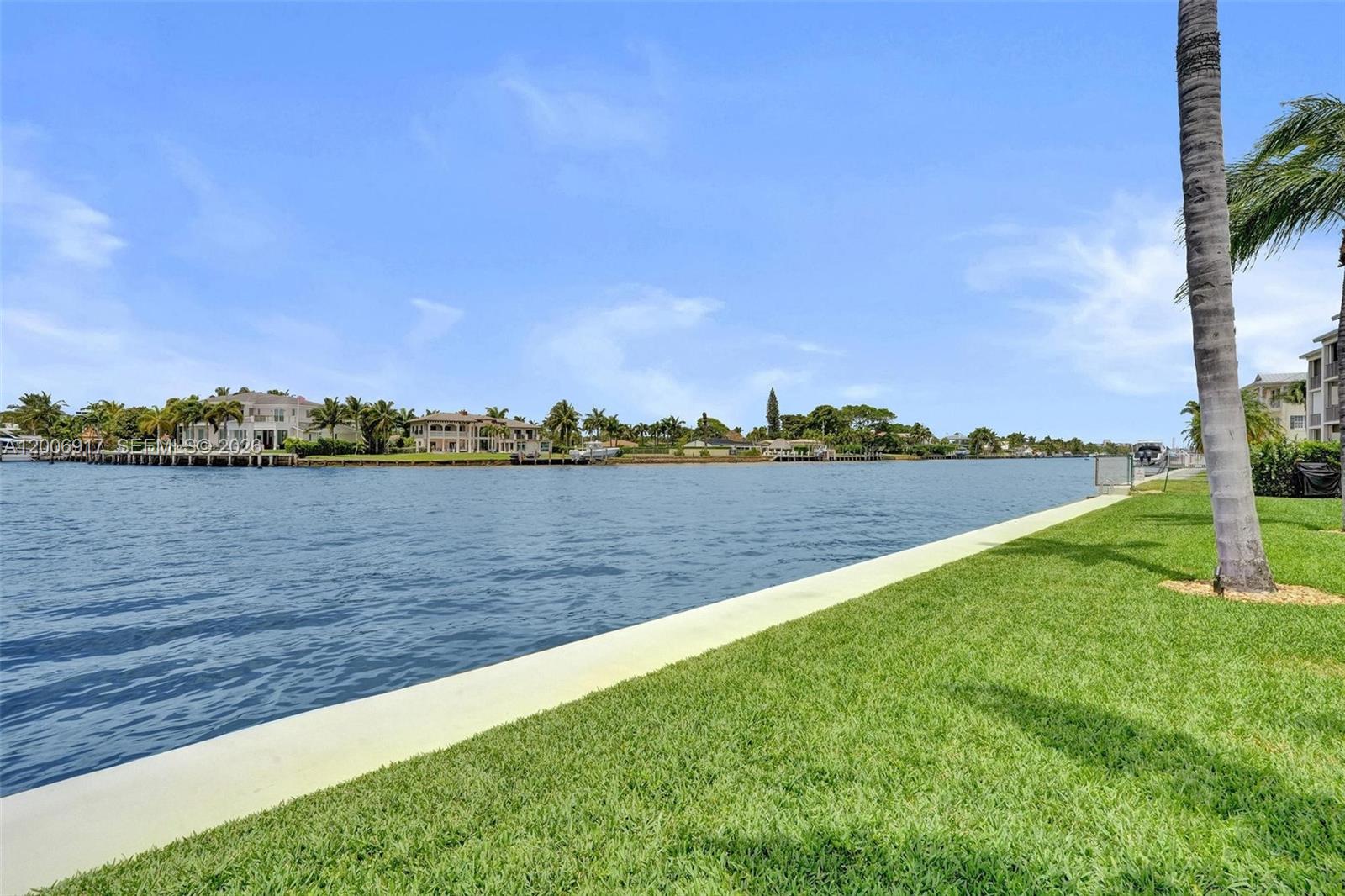 1105 South Riverside Drive, Unit 107 Pompano Beach, FL 33062 - Photo 21 of 31 a view of a lake with houses in the background