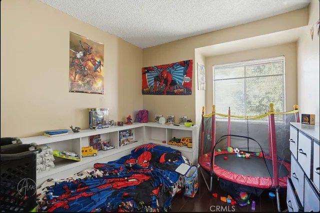 a bedroom with furniture and a gate