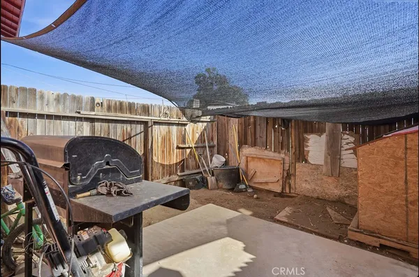a table and chairs in front of a house