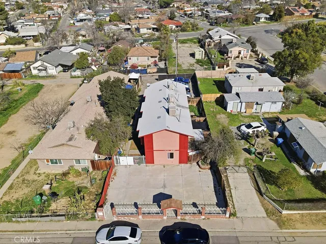 an aerial view of residential houses with outdoor space