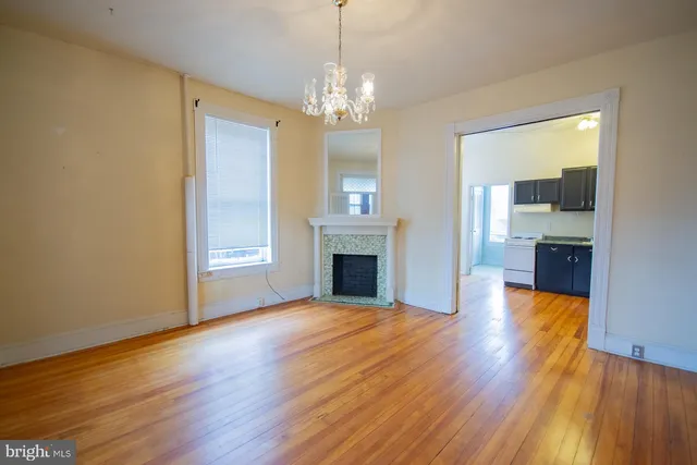 a bathroom with a toilet and a window