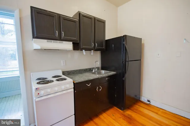 a bathroom with a sink a mirror and a bathtub
