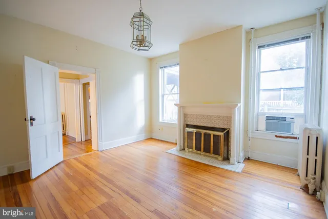 a white bath tub sitting next to a white toilet