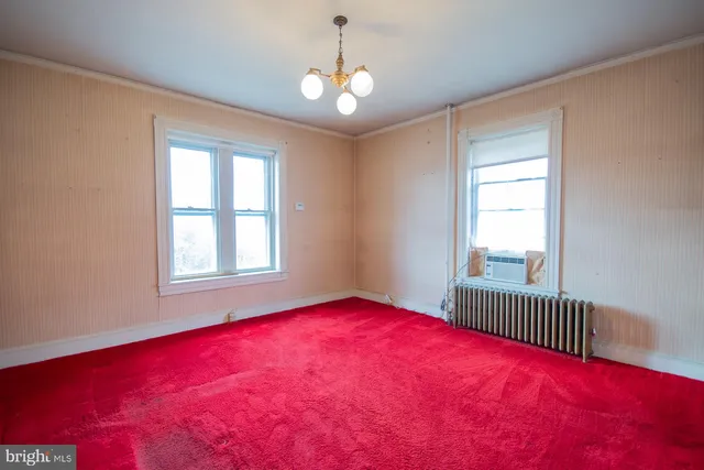 a front view of a building with street view