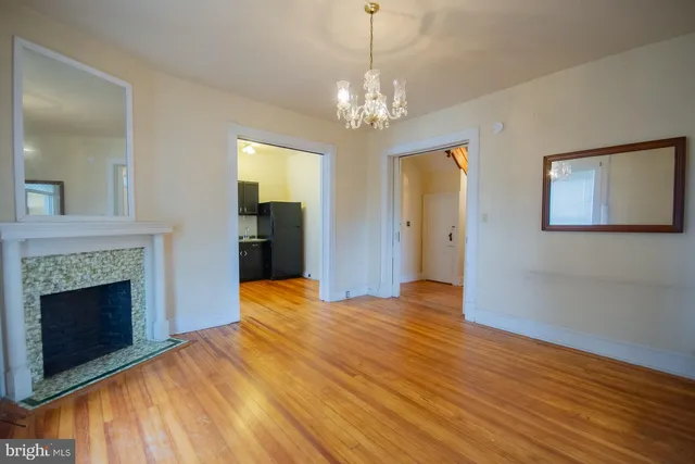 a kitchen with stainless steel appliances granite countertop a refrigerator and a stove