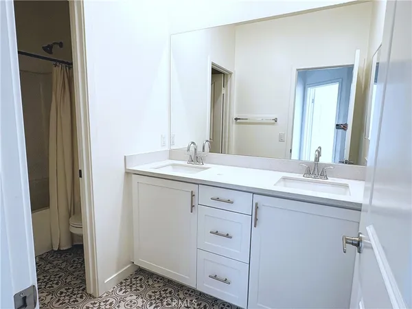 a bathroom with a shower and a toilet