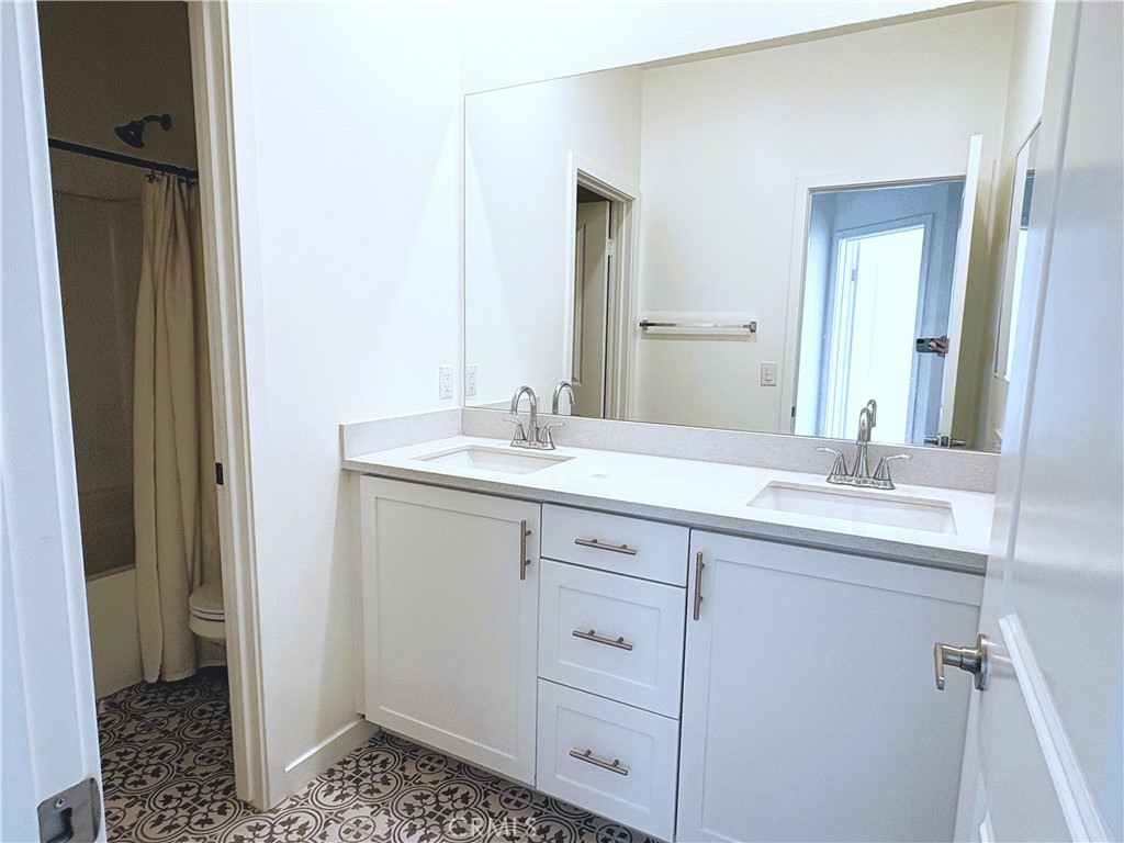1368 Anise Way Upland, CA 91786 - Photo 11 of 20 a bathroom with a double vanity sink a and mirror