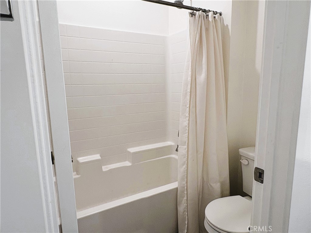 1368 Anise Way Upland, CA 91786 - Photo 12 of 20 a bathroom with a shower and a toilet