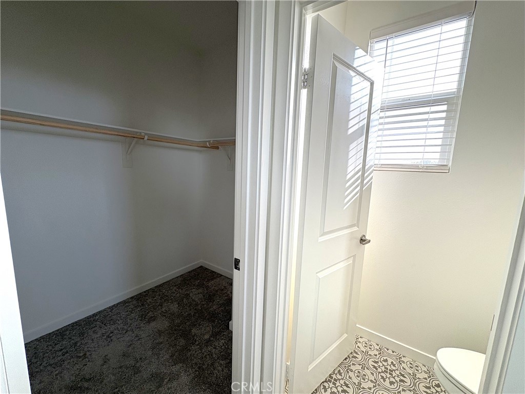 1368 Anise Way Upland, CA 91786 - Photo 14 of 20 a bathroom with a window and a shower