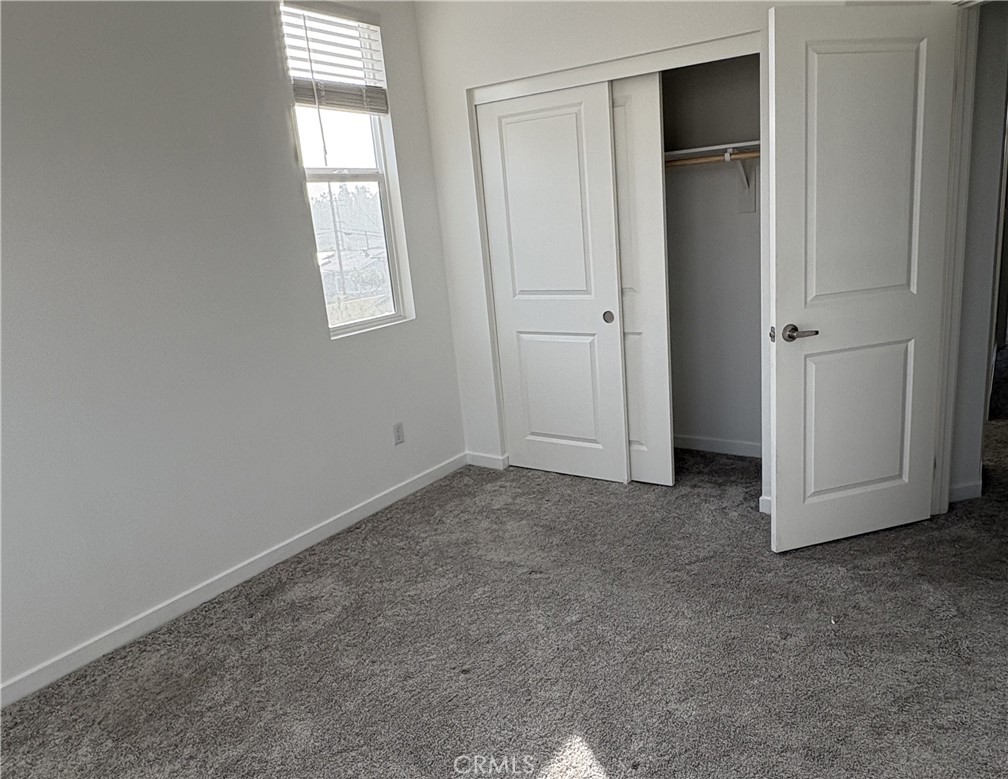 1368 Anise Way Upland, CA 91786 - Photo 18 of 20 an empty room with windows and closet
