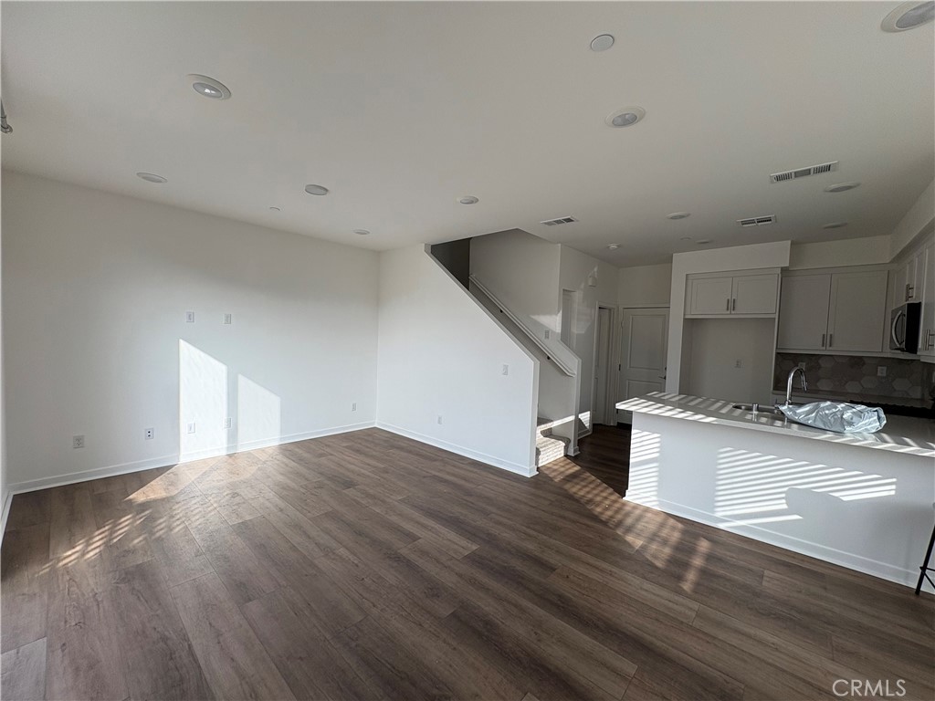 1368 Anise Way Upland, CA 91786 - Photo 4 of 20 a kitchen with a sink and a refrigerator