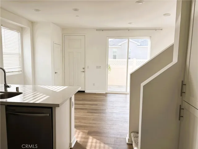 a white toilet sitting next to a sink