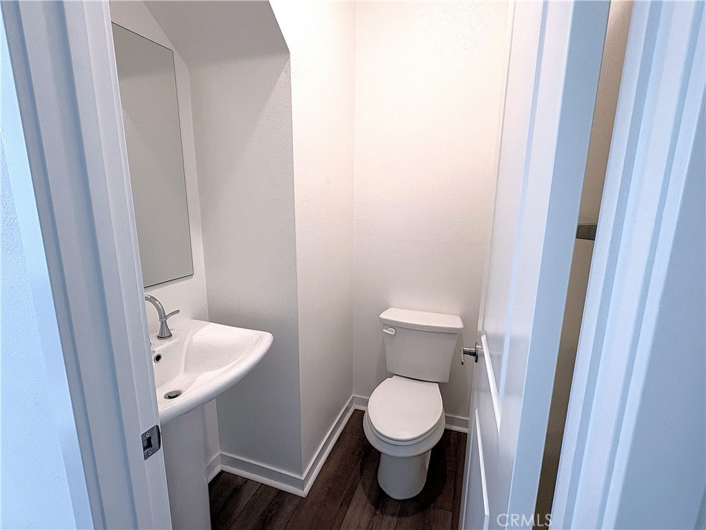 1368 Anise Way Upland, CA 91786 - Photo 7 of 20 a white toilet sitting next to a sink