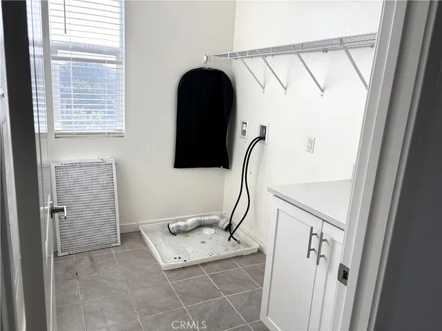 a bathroom with a double vanity sink a and mirror
