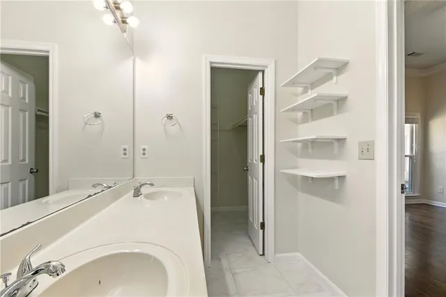 a bathroom with a sink and shower