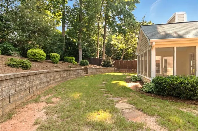 a aerial view of a house with a yard