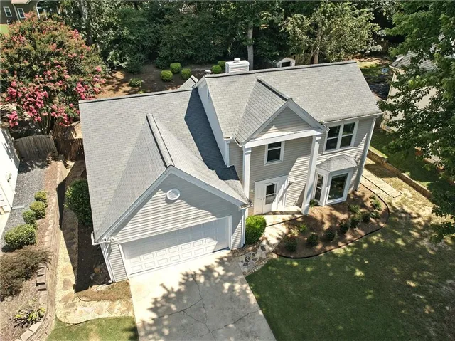 an aerial view of residential houses with outdoor space