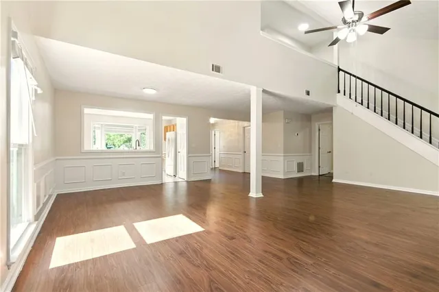 wooden floor in an empty room with a window