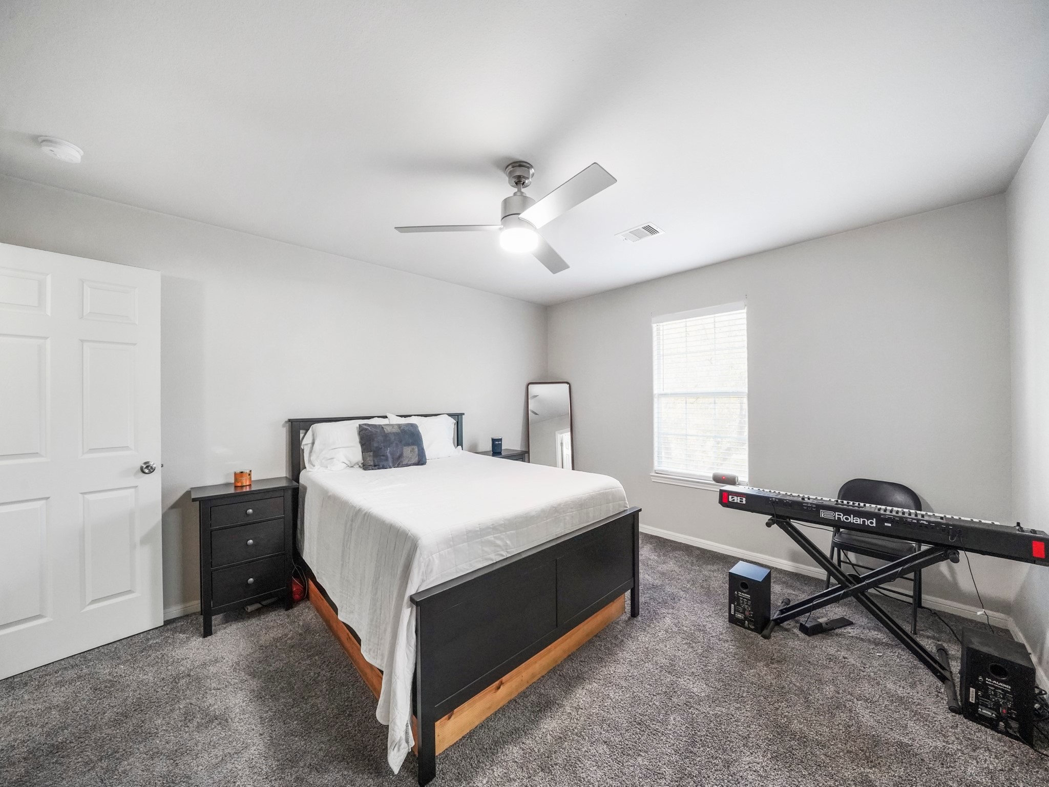 910 Rosewick Street Houston, TX 77015 - Photo 5 of 14 a bed room with a bed and a window