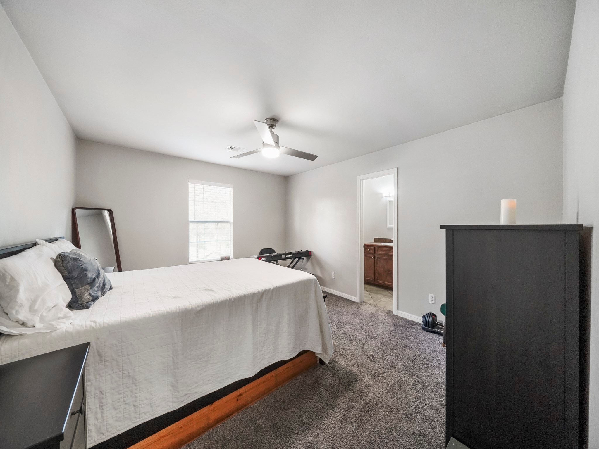 910 Rosewick Street Houston, TX 77015 - Photo 6 of 14 a bedroom with a bed and window