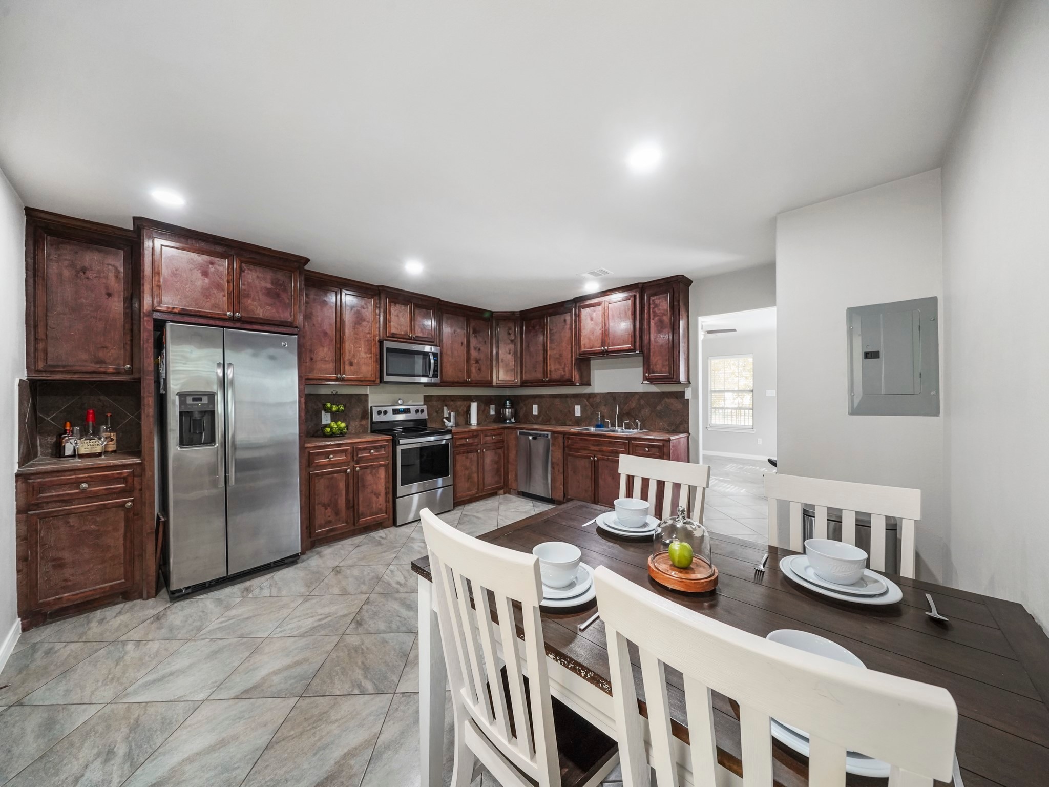 910 Rosewick Street Houston, TX 77015 - Photo 10 of 14 a kitchen with stainless steel appliances granite countertop a sink and refrigerator