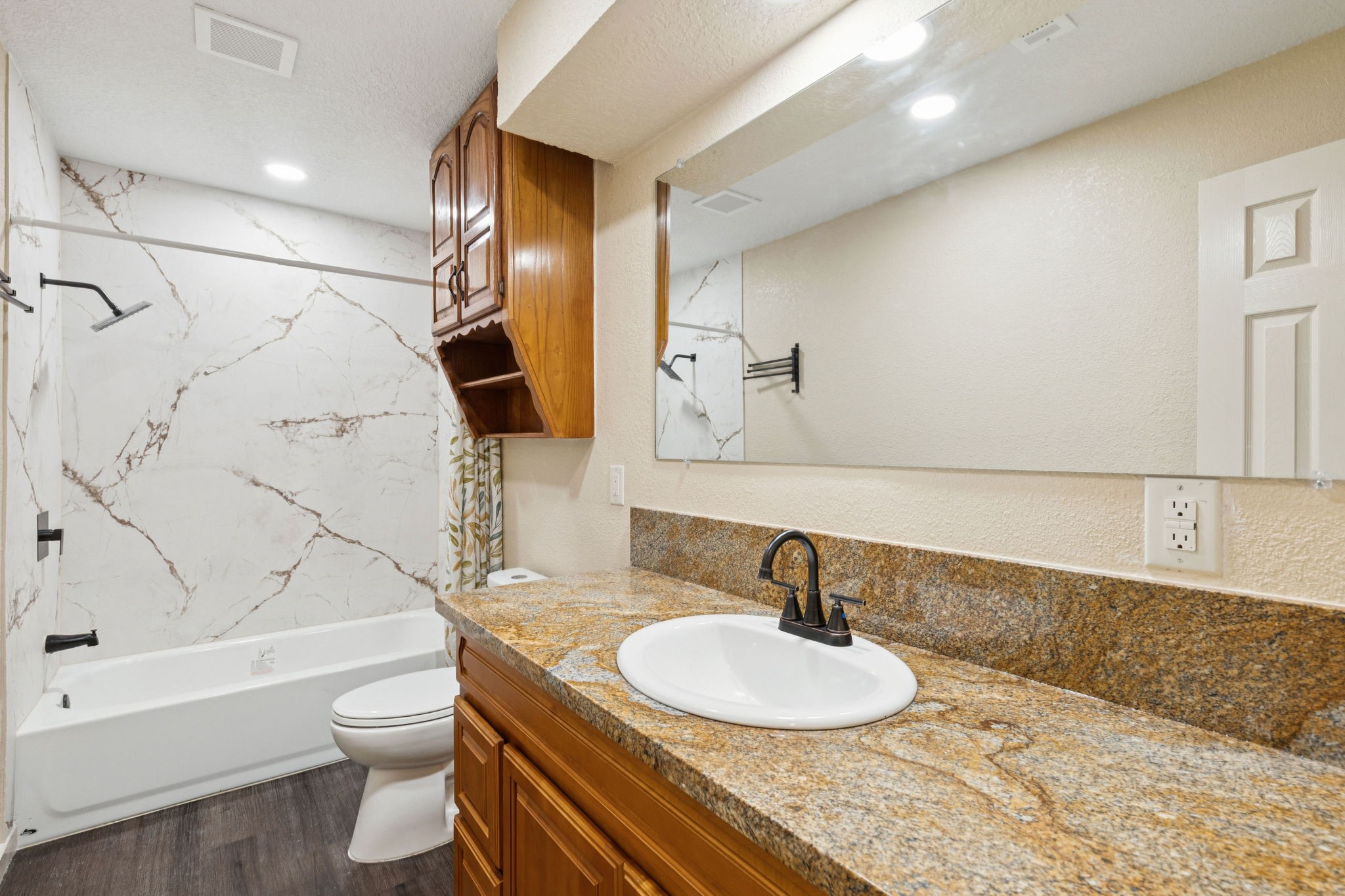 185 Hunters Lane Sweeny, TX 77480 - Photo 11 of 22 a bathroom with a sink and a mirror