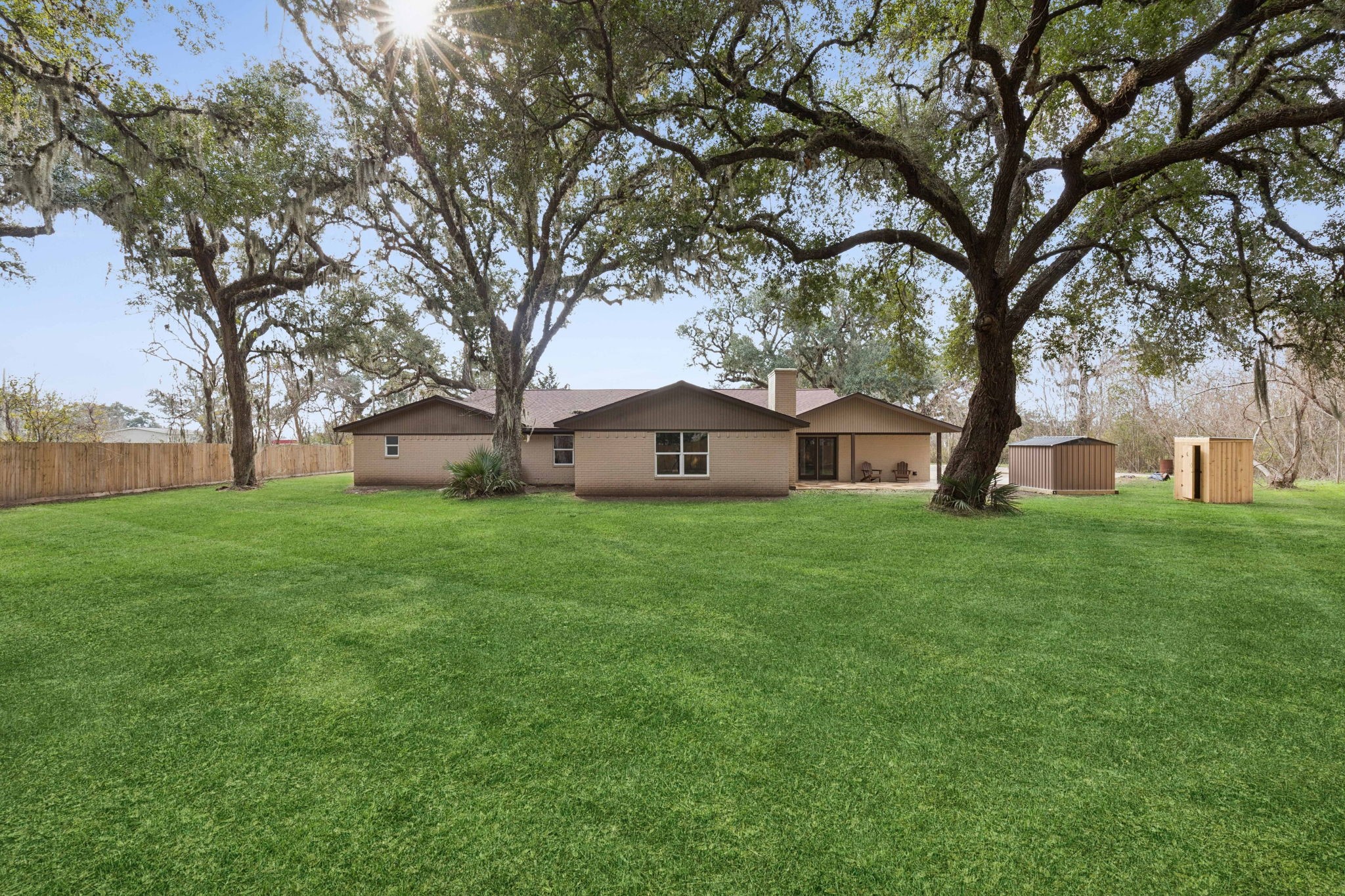 185 Hunters Lane Sweeny, TX 77480 - Photo 14 of 22 a view of a house with a back yard