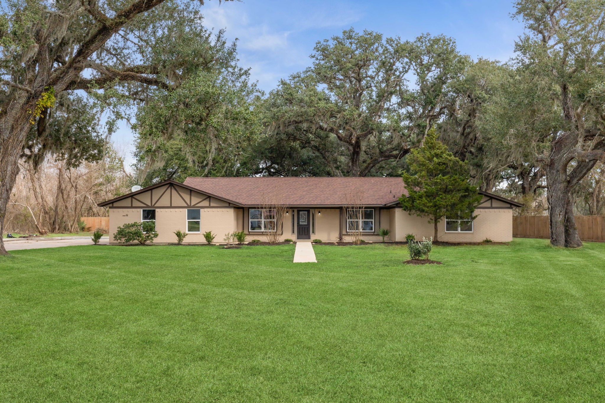 185 Hunters Lane Sweeny, TX 77480 - Photo 15 of 22 a white house with a big yard and large trees