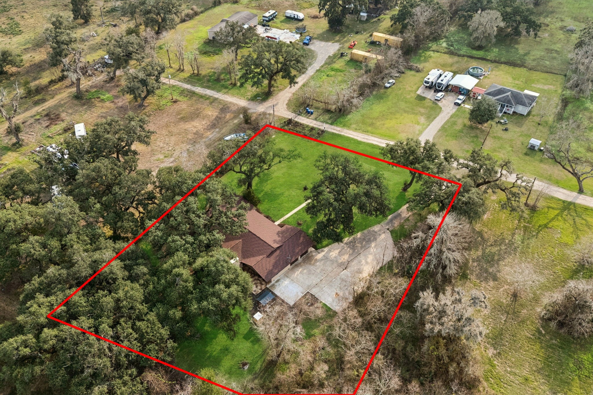 185 Hunters Lane Sweeny, TX 77480 - Photo 19 of 22 an aerial view of a house with a yard and lake view