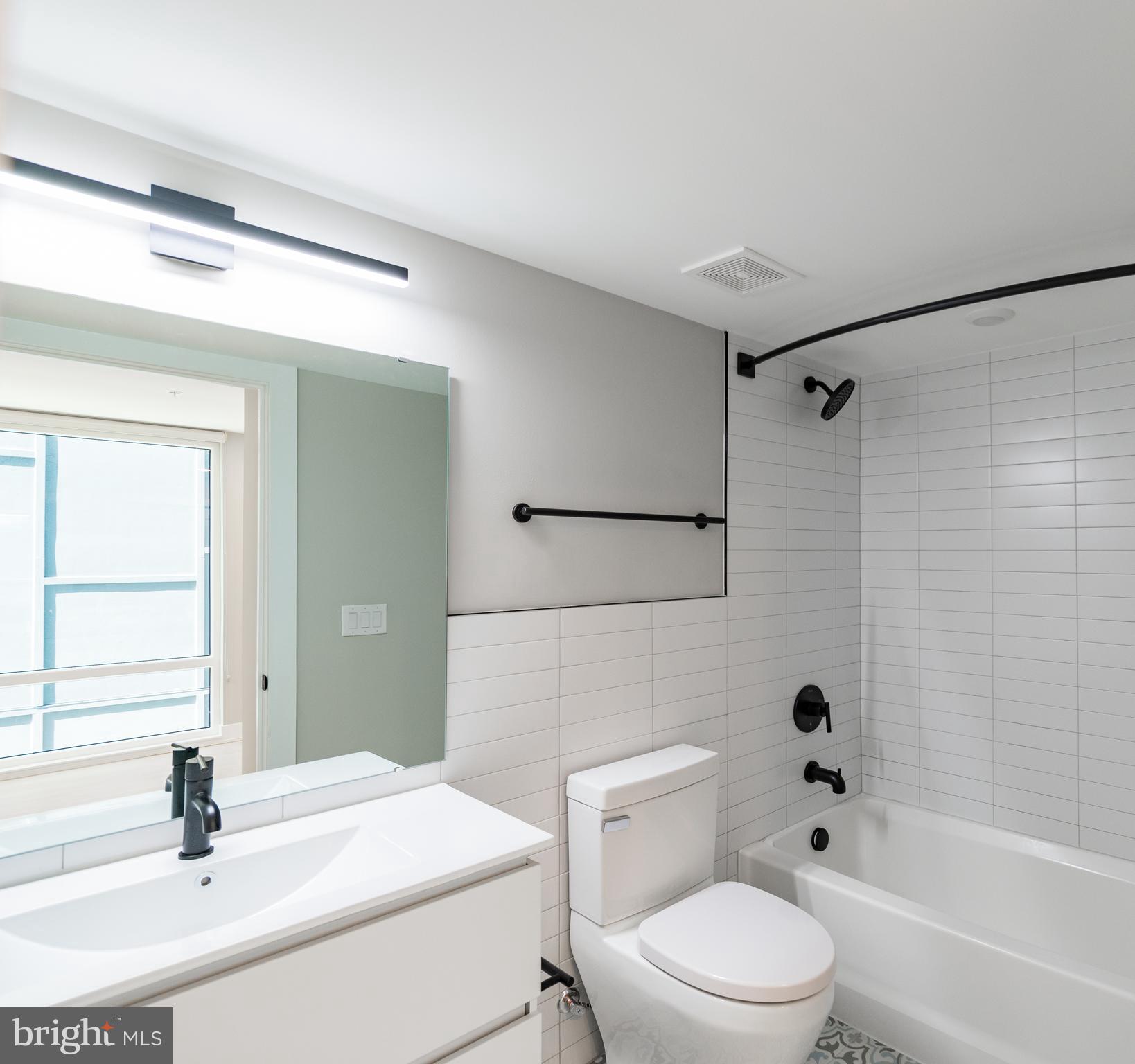 6604 Ridge Avenue, Unit 401 Philadelphia, PA 19128 - Photo 11 of 11 a bathroom with a sink toilet and shower