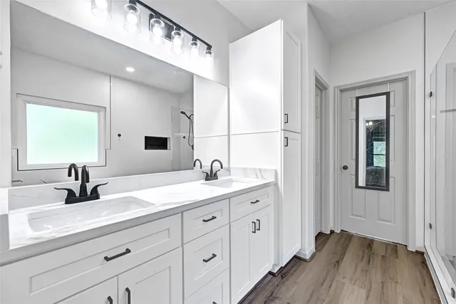 a bathroom with a sink and a mirror