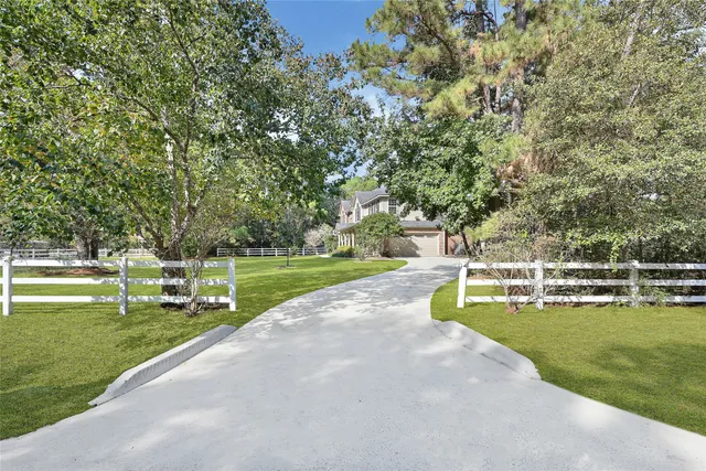 a view of a swimming pool with a yard