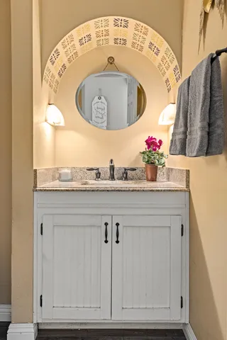 a bathroom with a sink and a mirror