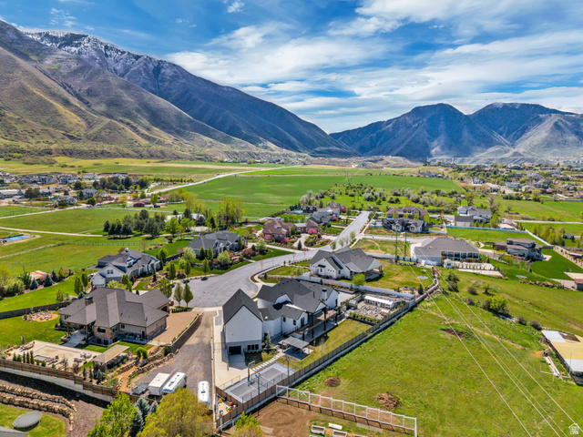 1720 Hillcrest Circle Mapleton, UT 84664 - Photo 24 of 116 Aerial perspective of suburban area featuring a mountainous background