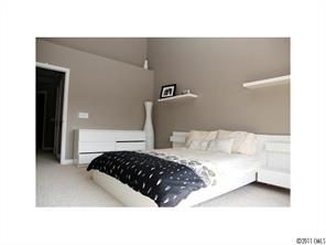 1035 Market Street, Unit 1035 Fort Mill, SC 29708 - Photo 11 of 16 a bedroom with a bed and a painting